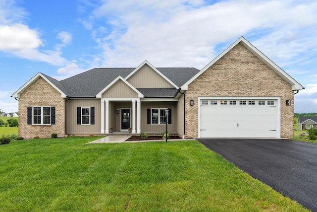409 Peterson Ln, Waynesboro, VA 22980 - view of front facade featuring asphalt driveway, a front lawn, an attached garage, brick siding, and roof with shingles