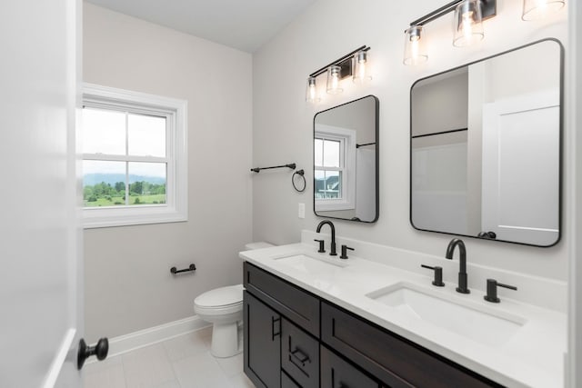 409 Peterson Ln, Waynesboro, VA 22980 - full bathroom featuring baseboards, toilet, and double vanity