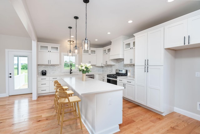 409 Peterson Ln, Waynesboro, VA 22980 - kitchen featuring appliances with stainless steel finishes, a sink, healthy amount of natural light, tasteful backsplash, and recessed lighting
