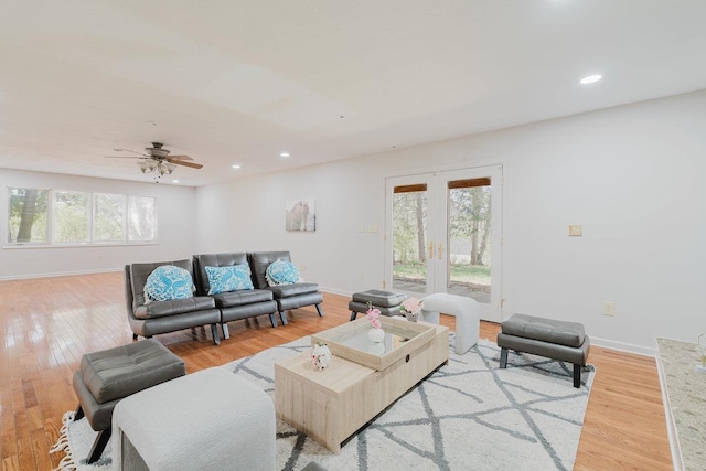 living room with baseboards, recessed lighting, ceiling fan, wood finished floors, and french doors