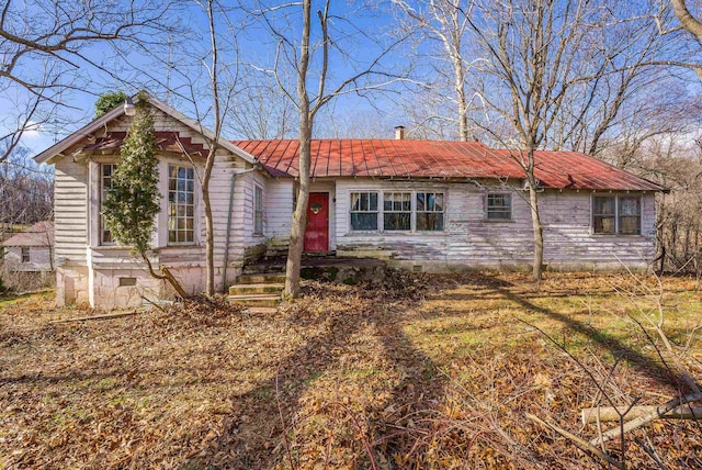 ranch-style house with crawl space and metal roof