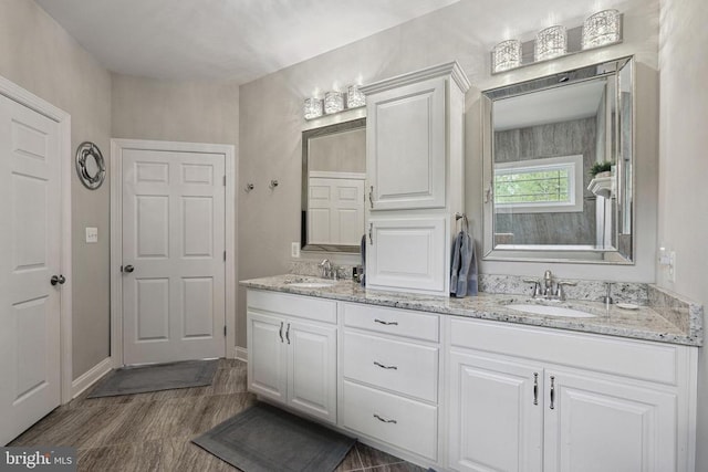 5761 Agecroft Rd, Spotsylvania, VA 22551 - full bathroom with double vanity and wood finished floors