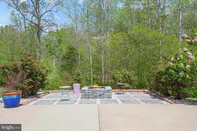 5761 Agecroft Rd, Spotsylvania, VA 22551 - view of patio / terrace featuring an outdoor fire pit