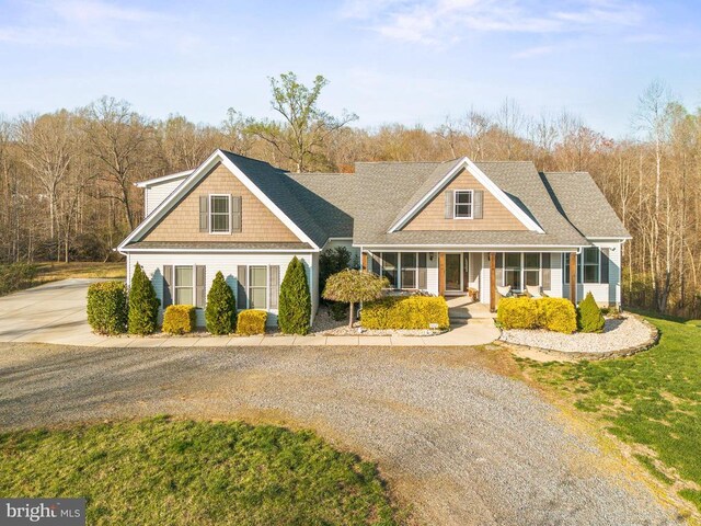 5761 Agecroft Rd, Spotsylvania, VA 22551 - traditional home with gravel driveway, a porch, and a front yard