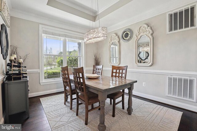 5761 Agecroft Rd, Spotsylvania, VA 22551 - dining area featuring a chandelier, hardwood / wood-style floors, crown molding, and a raised ceiling