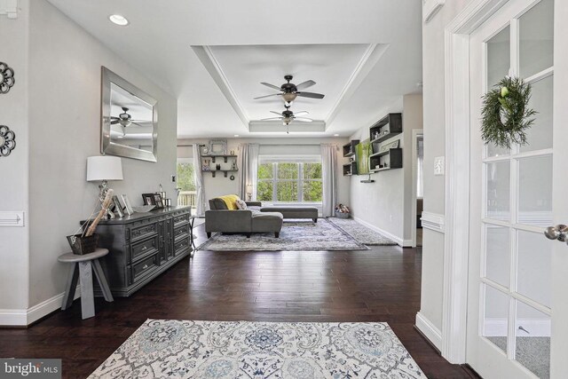 5761 Agecroft Rd, Spotsylvania, VA 22551 - living area featuring ceiling fan, hardwood / wood-style floors, a tray ceiling, and baseboards