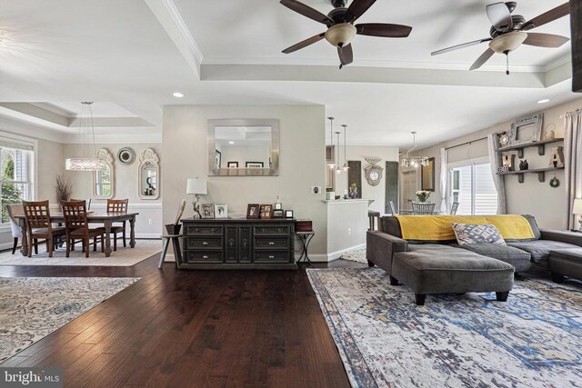 5761 Agecroft Rd, Spotsylvania, VA 22551 - living area featuring a tray ceiling, ceiling fan, dark wood-style flooring, crown molding, and recessed lighting