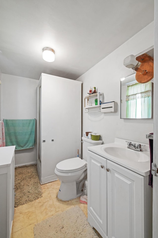 bathroom featuring toilet and vanity