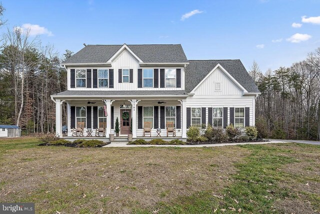 view of front facade with a front yard and a porch