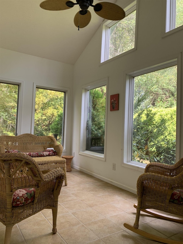 sunroom / solarium featuring ceiling fan, vaulted ceiling, and a wealth of natural light