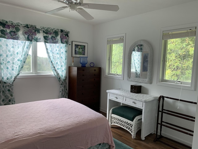 bedroom featuring dark hardwood / wood-style floors and ceiling fan