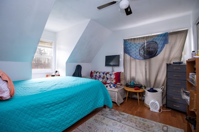 bedroom with lofted ceiling, hardwood / wood-style floors, and ceiling fan