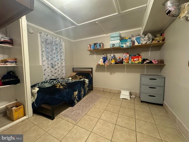 bedroom with light tile patterned flooring