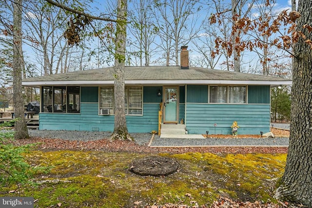 view of front of home featuring a sunroom