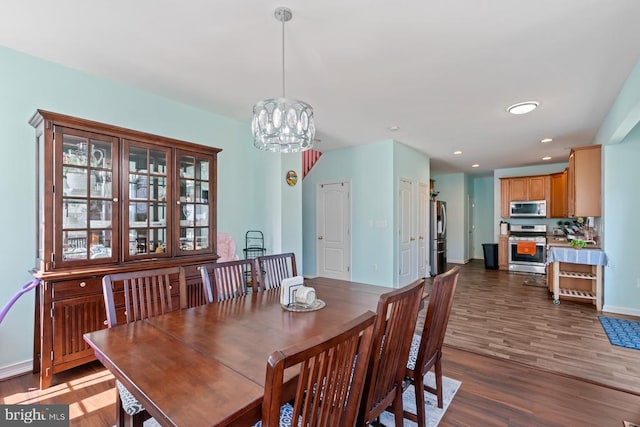 dining space with a chandelier, dark wood-style flooring, baseboards, and recessed lighting