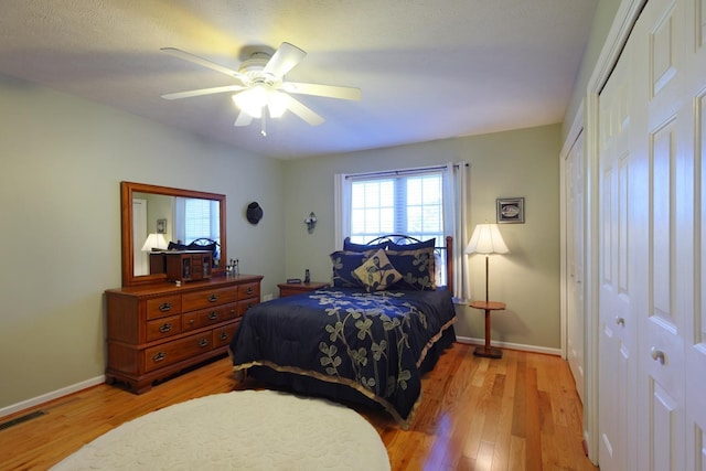 bedroom with ceiling fan and light hardwood / wood-style flooring