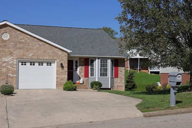 view of front of house with a garage and a front lawn