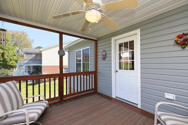 wooden deck featuring ceiling fan