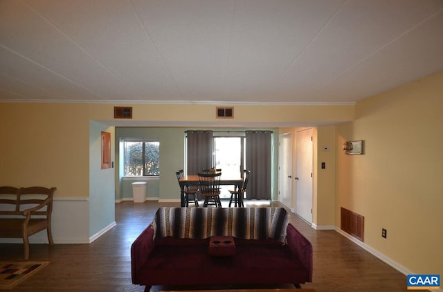 dining room featuring baseboards, visible vents, and dark wood-type flooring