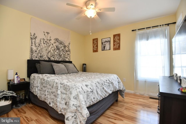 bedroom featuring hardwood / wood-style flooring and ceiling fan