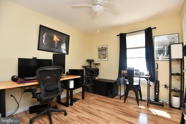 home office with ceiling fan and light wood-type flooring