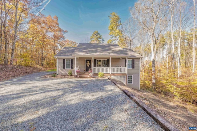 view of front of property with a porch and driveway