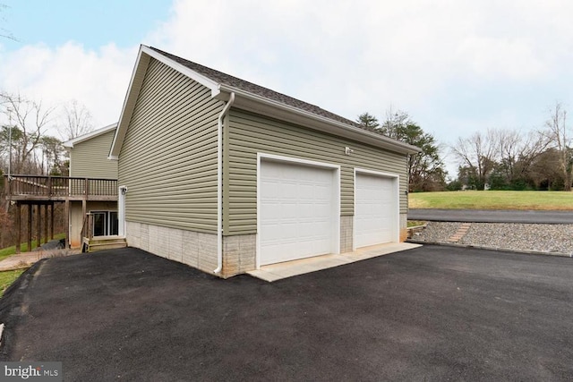 garage featuring aphalt driveway