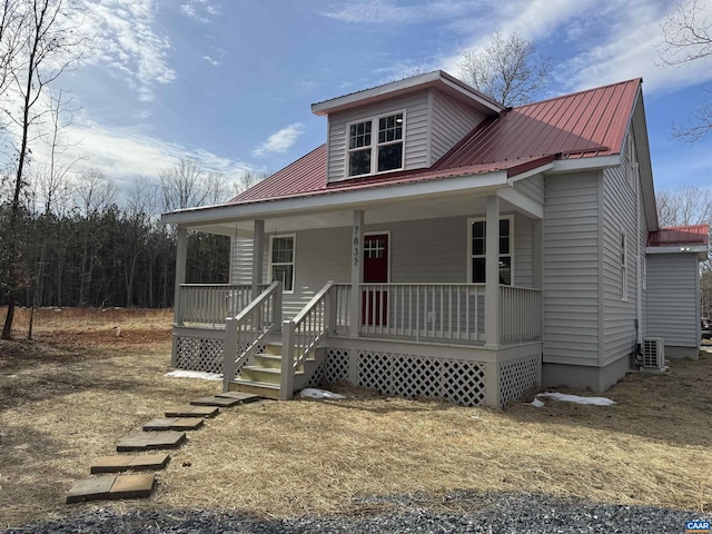 view of front of property with covered porch, metal roof, and central AC