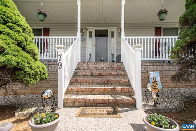 doorway to property featuring covered porch