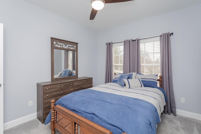 bedroom featuring carpet floors, baseboards, and a ceiling fan