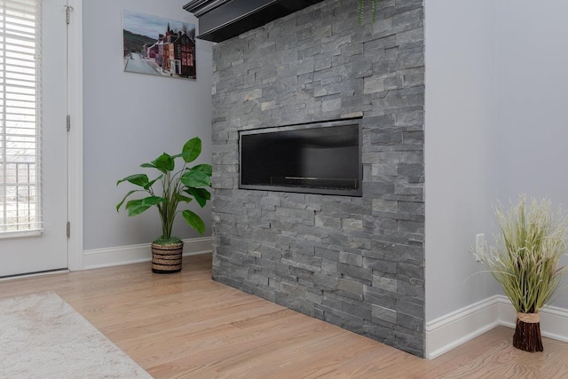 interior details with wood finished floors and baseboards