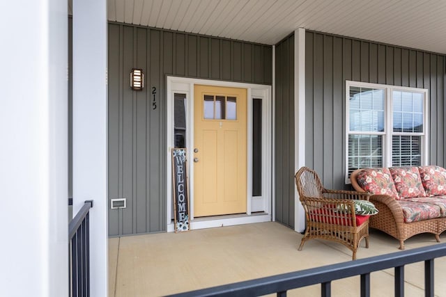 doorway to property featuring covered porch