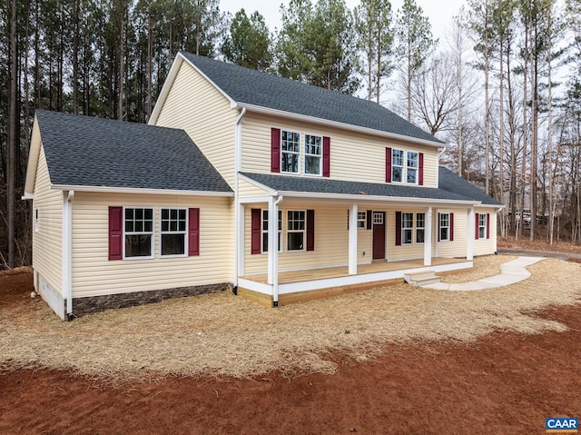 view of front of home featuring covered porch and roof with shingles