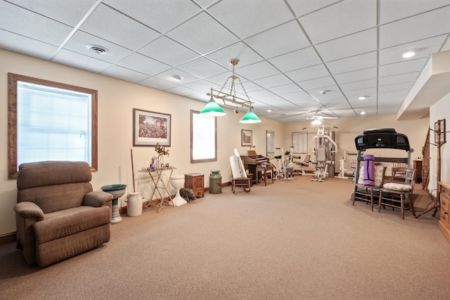 workout room with visible vents, a paneled ceiling, and carpet