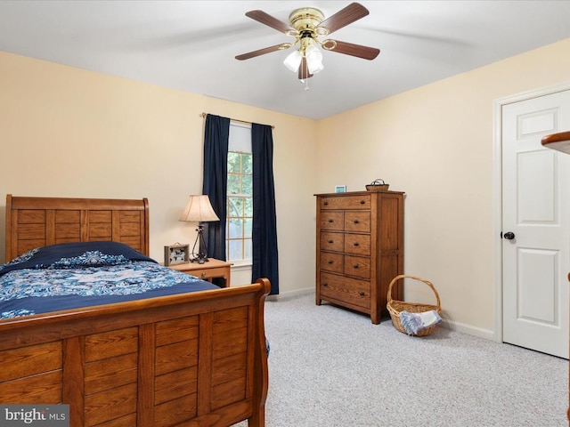 bedroom featuring light carpet and ceiling fan