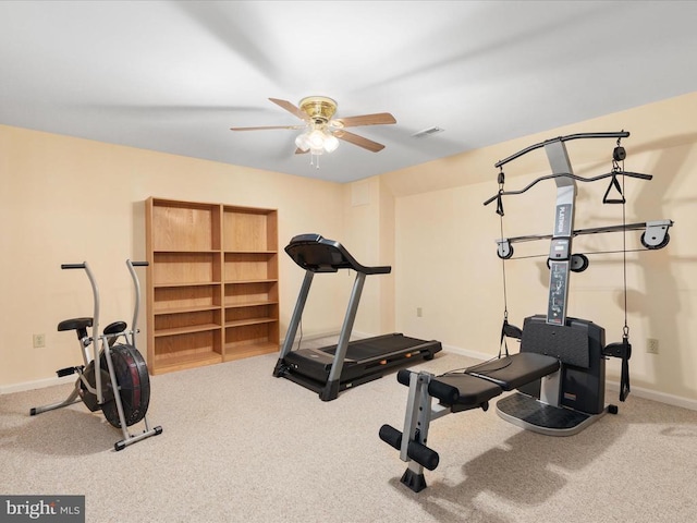 exercise room featuring ceiling fan and carpet floors