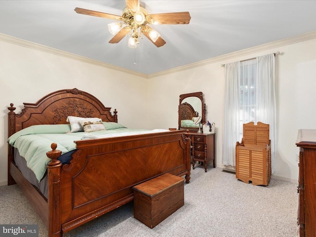 carpeted bedroom featuring crown molding and ceiling fan