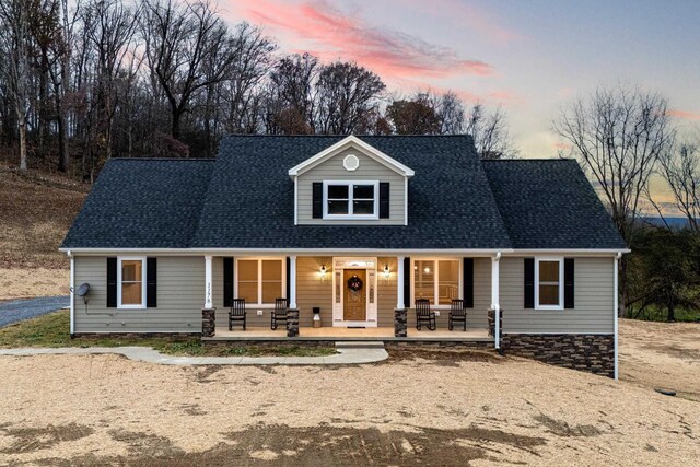 cape cod home with covered porch