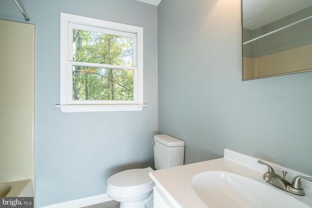 bathroom featuring vanity and toilet