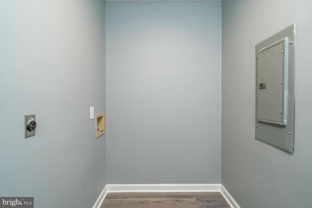 laundry area featuring electric dryer hookup, hookup for a washing machine, electric panel, and hardwood / wood-style flooring