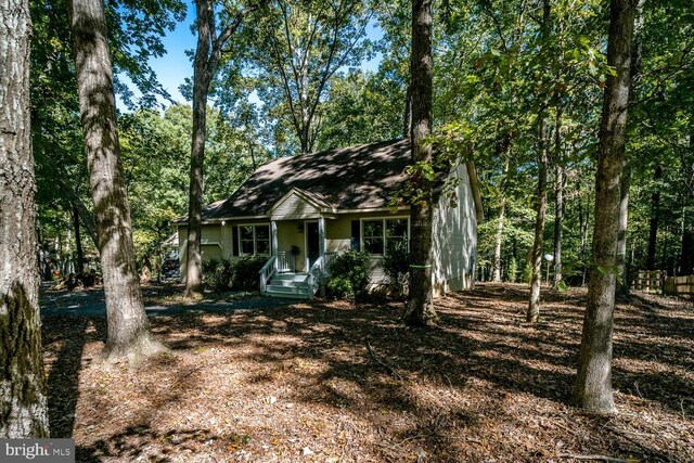 rear view of property with a deck