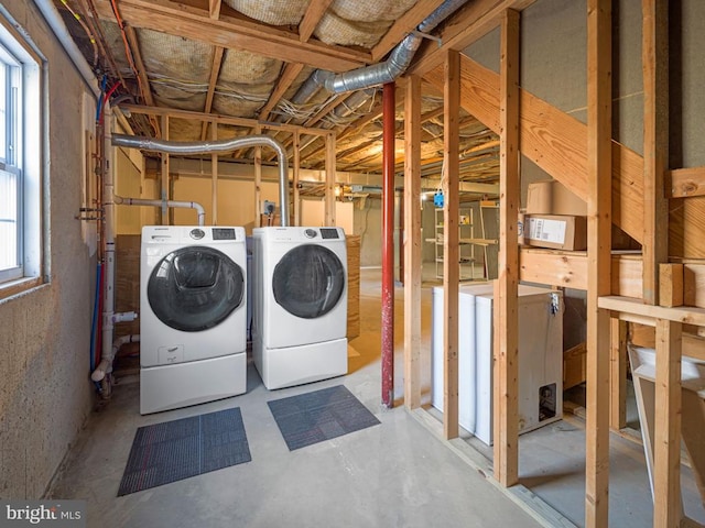 clothes washing area featuring laundry area and washing machine and dryer