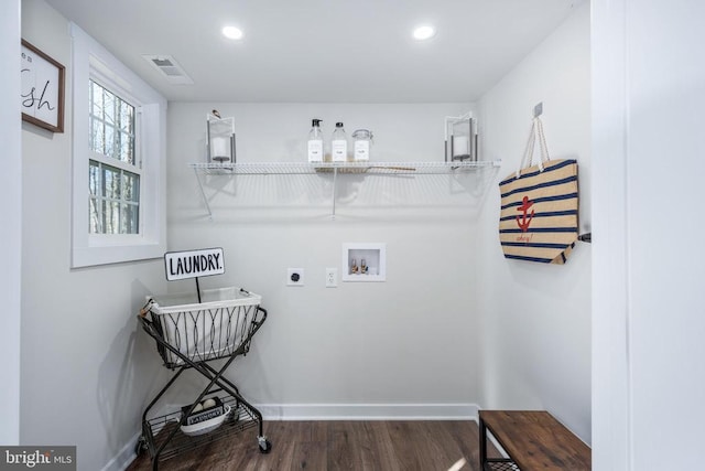 washroom featuring hookup for an electric dryer, laundry area, washer hookup, wood finished floors, and visible vents