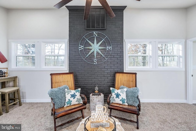 sitting room with carpet floors and baseboards