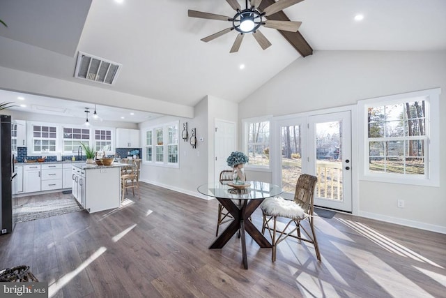 dining room featuring beam ceiling, visible vents, baseboards, and dark wood-style flooring