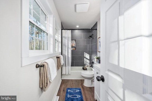 full bath featuring toilet, shower / bath combination with curtain, and wood finished floors