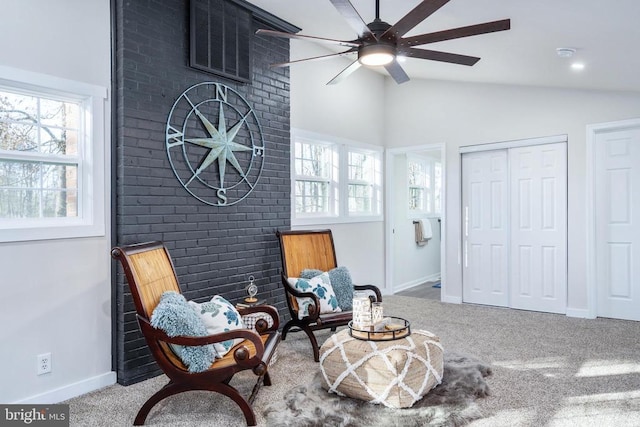 sitting room featuring carpet floors, baseboards, a ceiling fan, and lofted ceiling