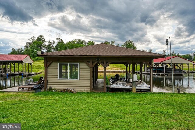 view of dock featuring a water view and a lawn