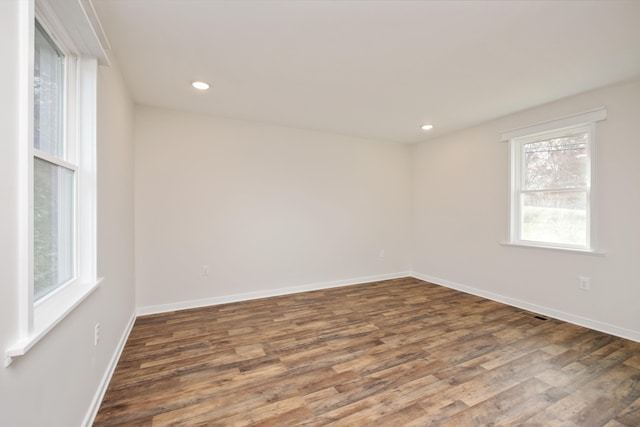 empty room featuring dark hardwood / wood-style floors