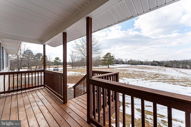 view of snow covered deck